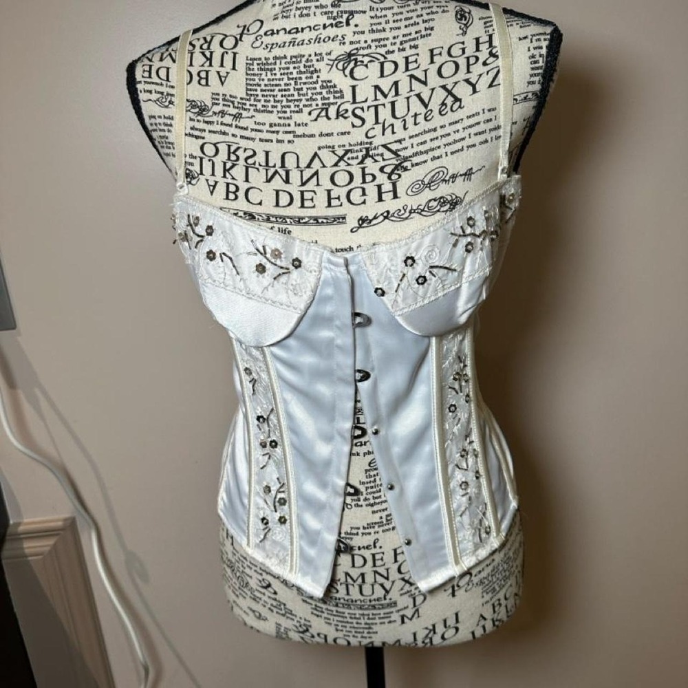 Vintage Coquette White corset with black text and decorative swirls